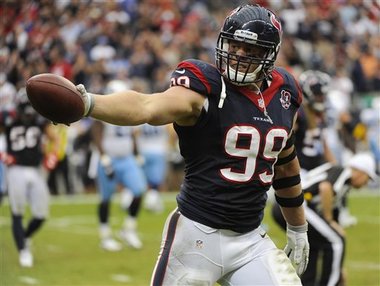 Houston Texans' J.J. Watt reacts after recovering a fumble during the fourth quarter of an NFL football game against the Tennessee Titans Sunday, Sept. 30, 2012, in Houston. (AP Photo/Dave Einsel)