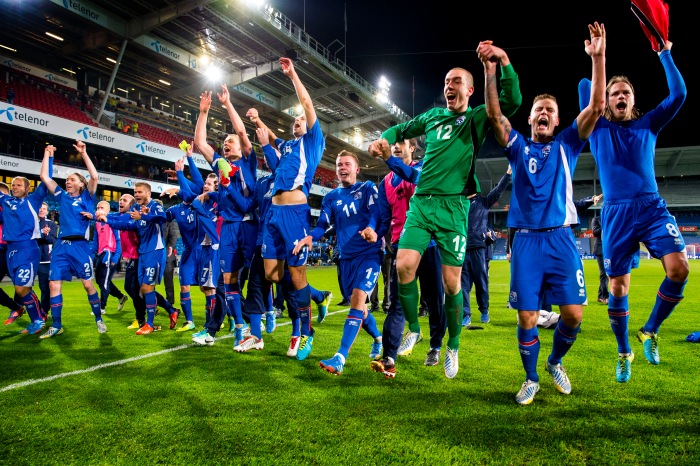 Iceland's team celebrates after their 2014 World Cup qualifying football match against Norway at Ullevaal stadium in Oslo